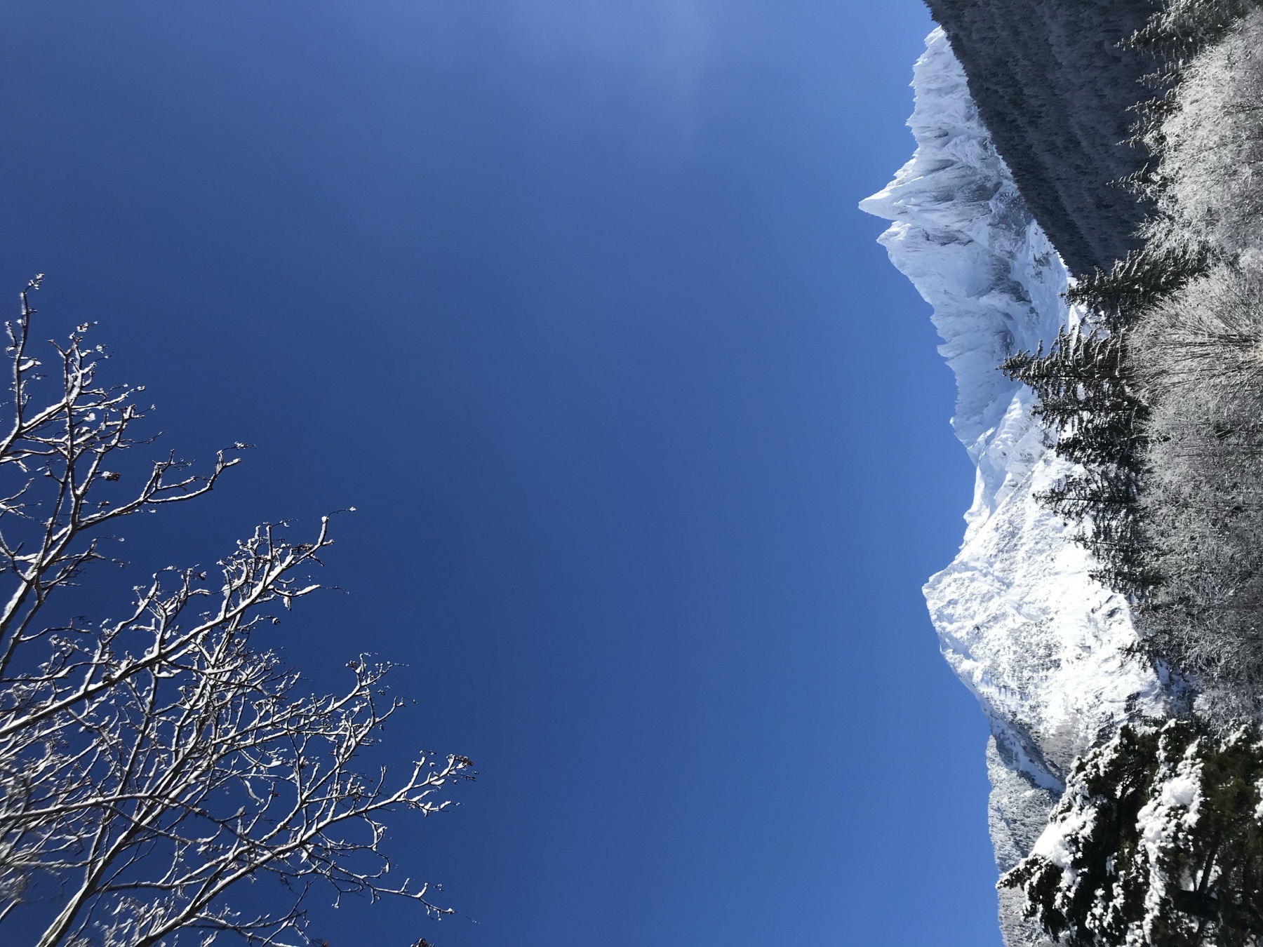 Snow-covered Aiguille Verte under a deep blue sky